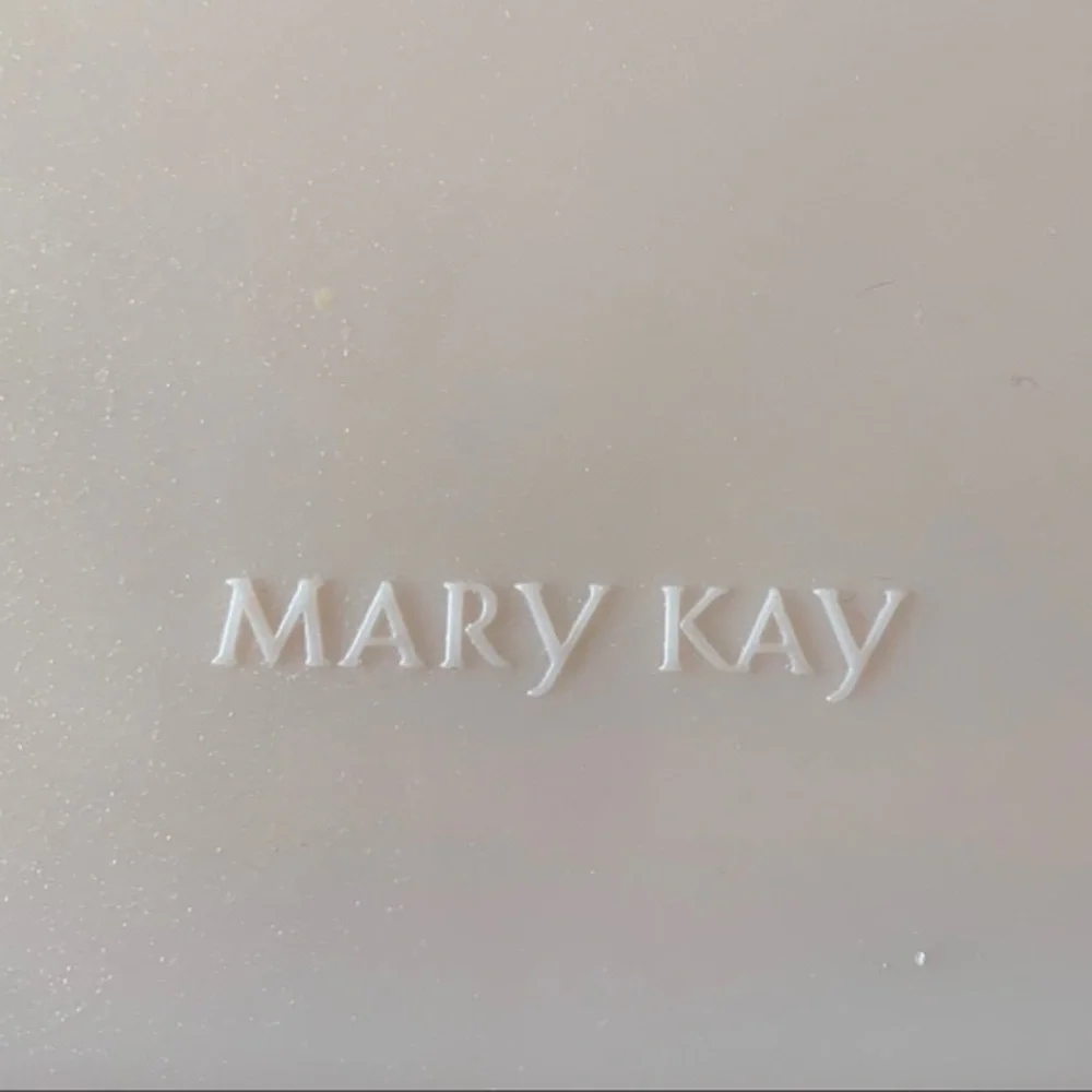 Mary Kay pink plastic compact travel mirror.